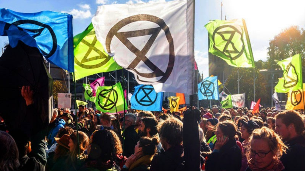 Rebels gather among mulit-coloured XR flags