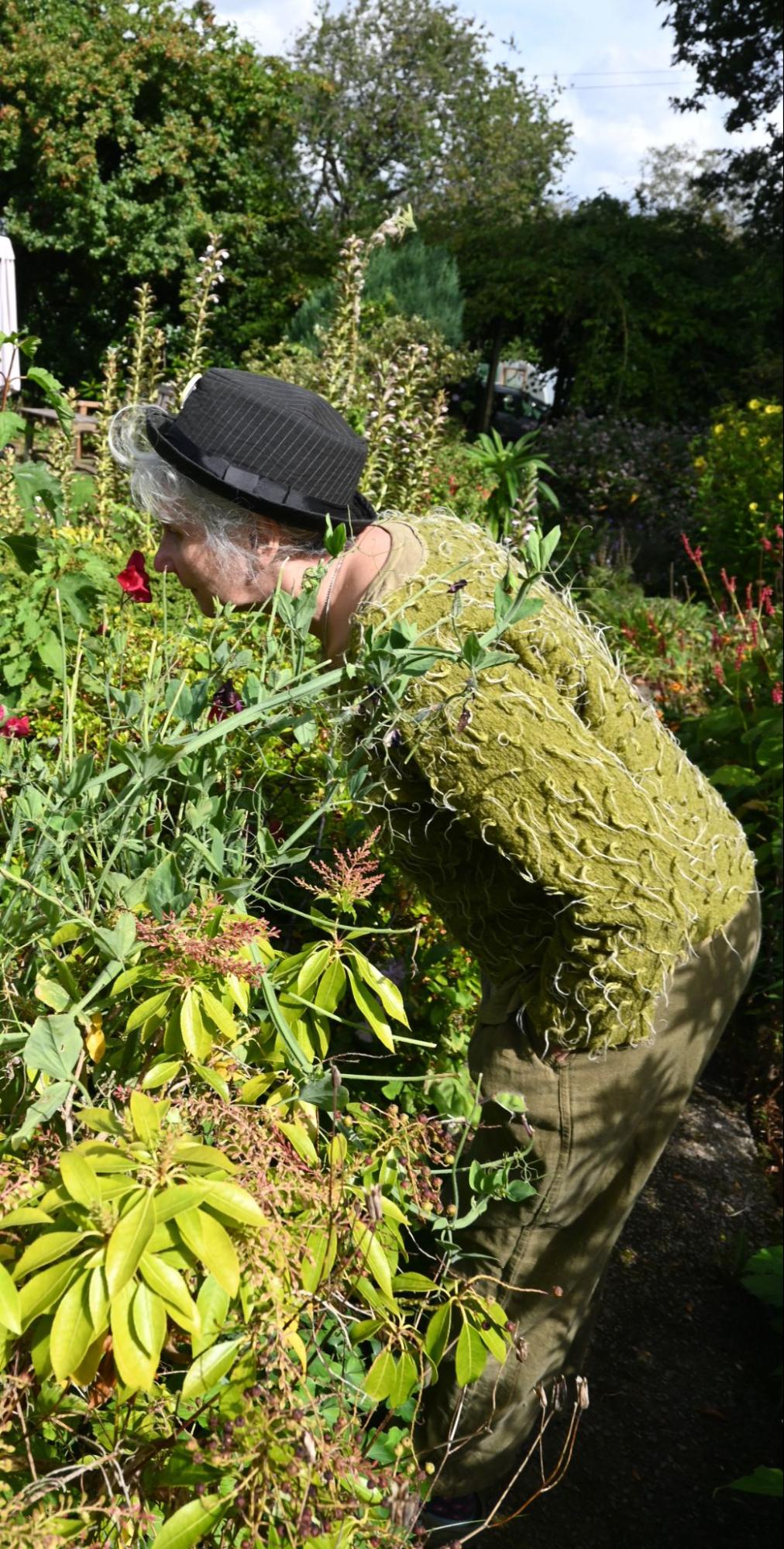 Photo: person smelling flowers