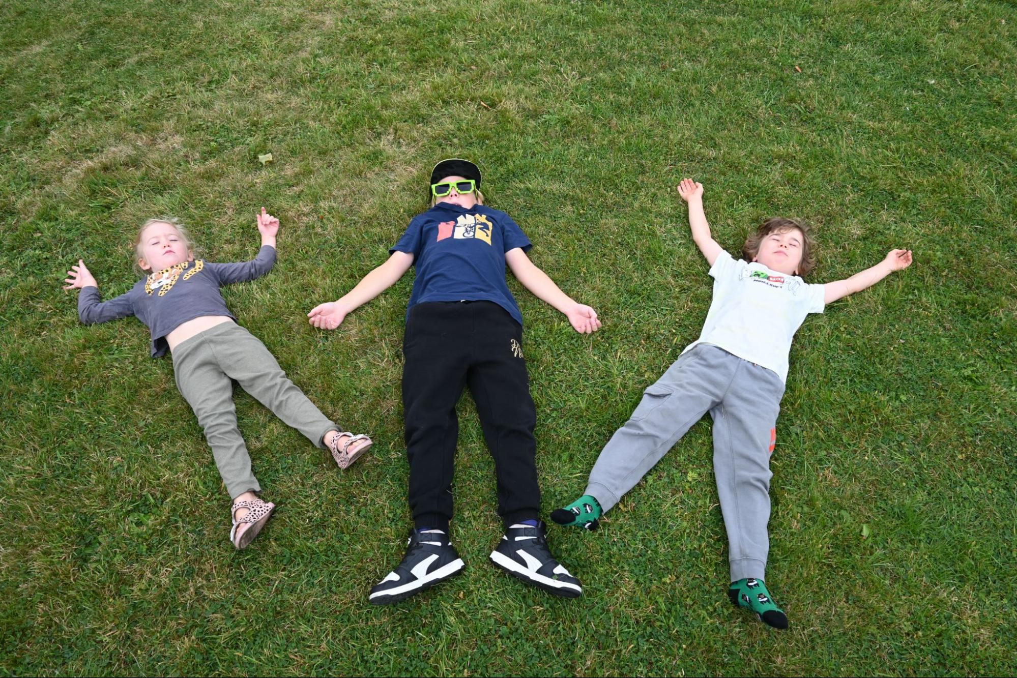 Photo: children relaxing on grass