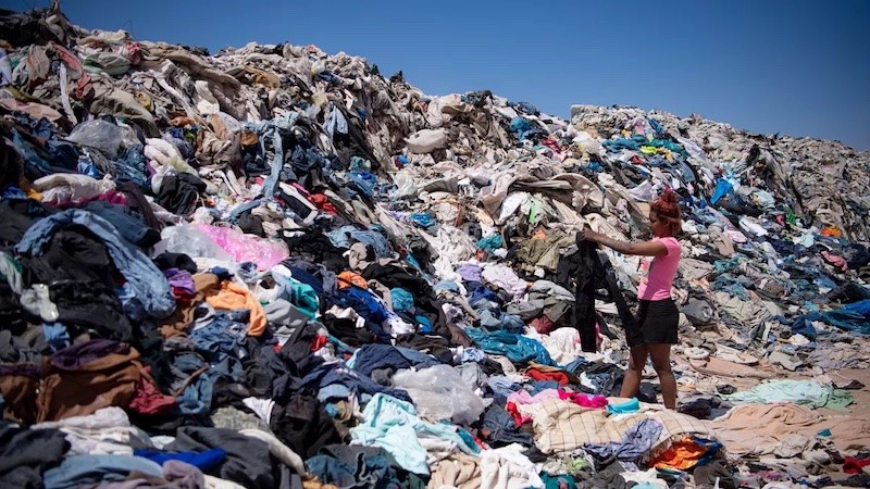 Photo: mountain of fabric waste at a landfill